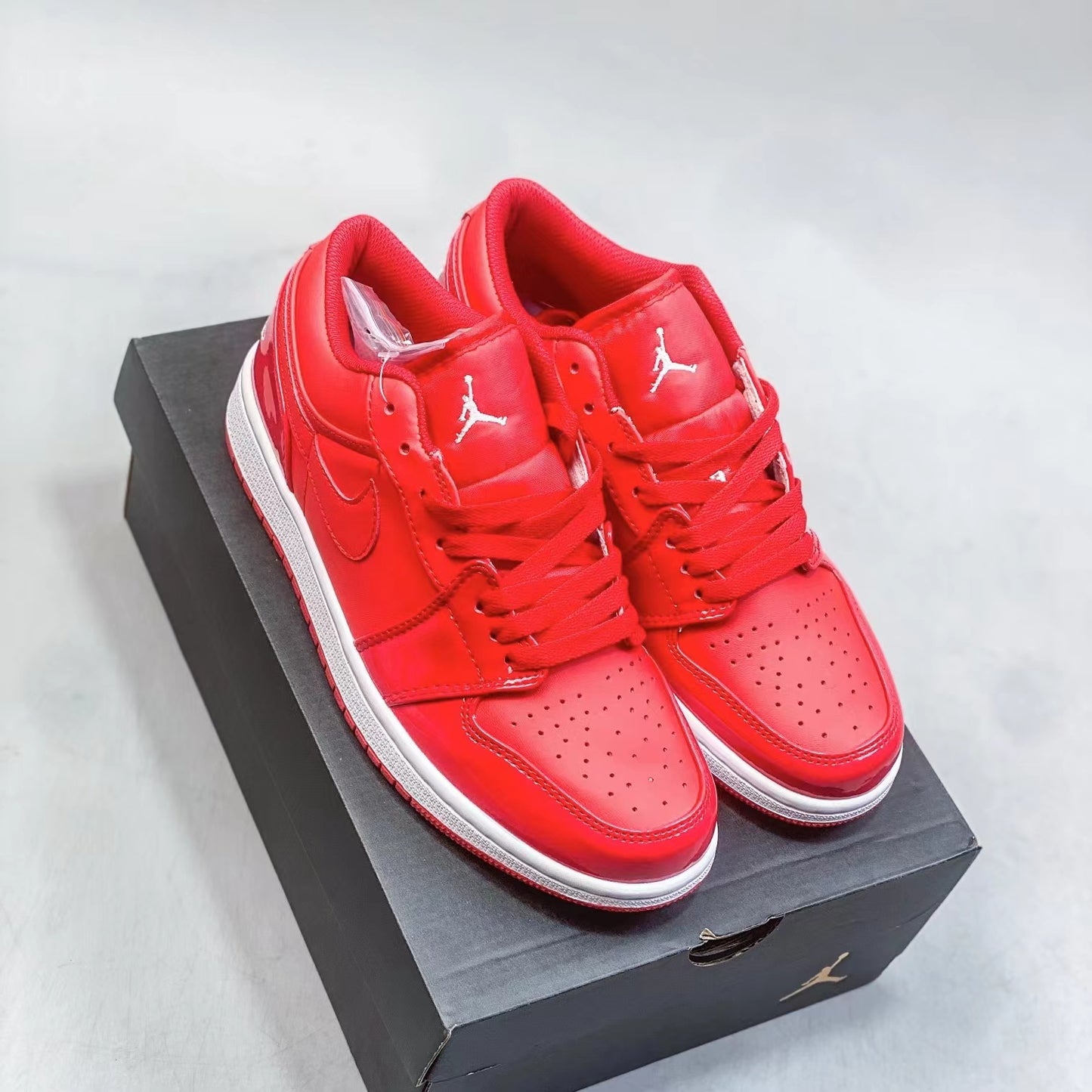 Nike Air Jordan 1 low Superficie laccata Rosso